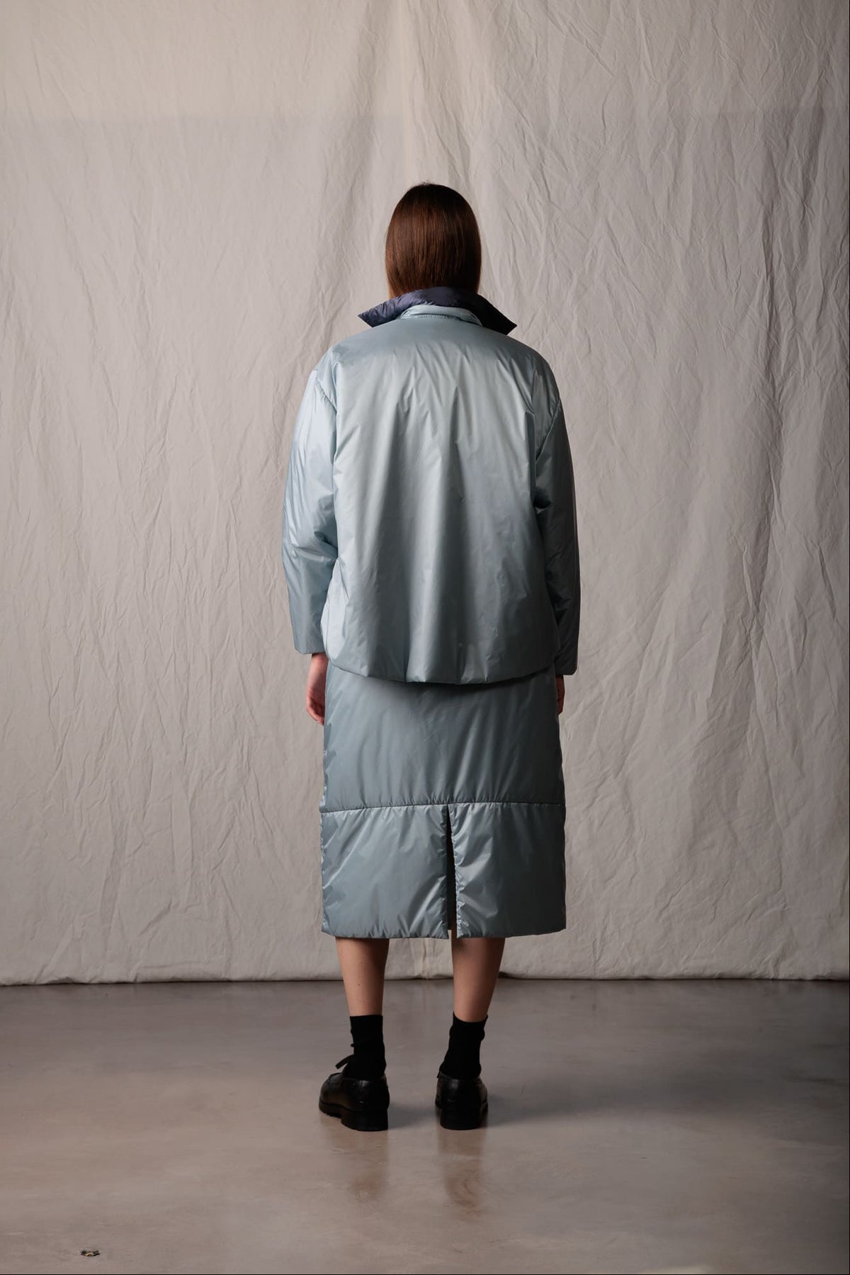 Asciari CLARA reversible padded overshirt for women in sky blue recycled tech fabric, back view, made in Italy